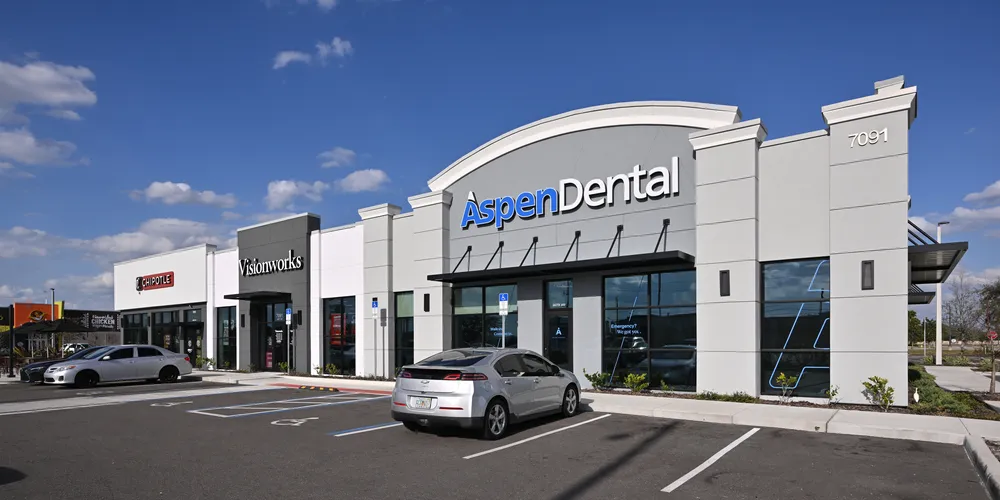 Aspen Dental clinic exterior at Vista Palms strip mall, Orlando, Florida, February 2025