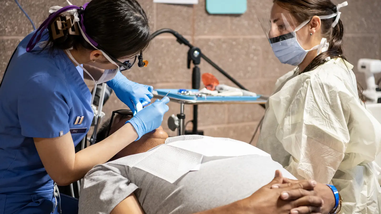 U.S. Army dentist and Indiana National Guard specialist providing dental services during Operation Walking Shield, July 2024