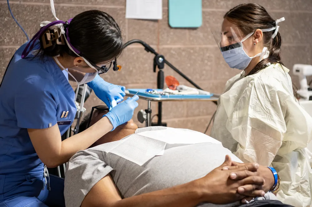 Dental team at treatment station providing dental services on the Blackfeet Reservation, Montana, during Operation Walking Shield, July 2024